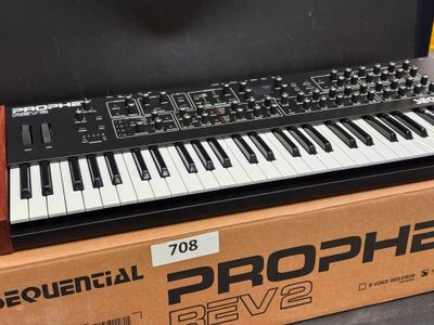 a box with a keyboard on top of it on a table
