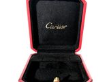 a red box with a gold ring inside of it