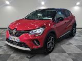a red car parked in a garage with a checkered floor