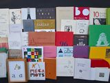 a lot of books that are on the table together