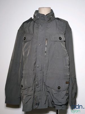 an image of a gray jacket on a mannequin stand