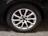 a close up of a tire on a car ' s rim