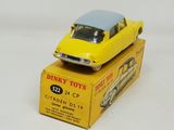 a yellow toy car sitting on top of a yellow box