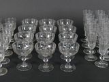 a lot of empty wine glasses sitting on a table