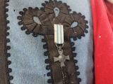 an image of a close up of a jacket with a cross on it