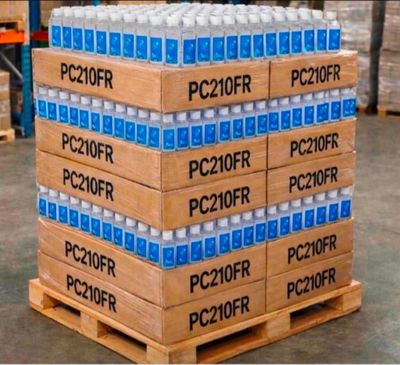 boxes of water are stacked on a pallet in a warehouse