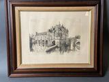 an old drawing of a castle in a frame hanging on a wall