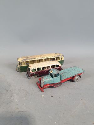 two toy trucks that are sitting next to each other