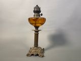 a glass lamp that is sitting on a table