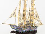 une image représentant la maquette d'un voilier sur fond blanc
