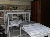 a room with a bunch of shelves and a refrigerator