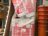 a large pile of boxes and other items in a garage