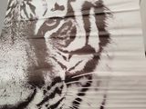 a picture of a tiger painted on the side of a bus