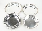 three silverplated ashtrays on a white background