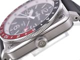 a close up of a wrist watch with a red and black face