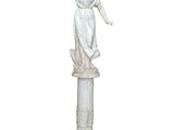 marble statue of a woman holding a bird on a pedestal