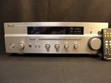 an image of a silver stereo system sitting on top of a table