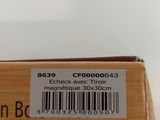 someone holding a box with a barcode on it and a barcode on it