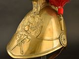 helmet of a roman soldier with red feathers on a stand
