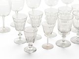 a lot of empty wine glasses on the table