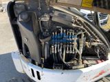 a small engine in the back of a truck