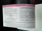 a certificate on the back of a car that is in the back seat of a car