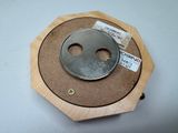 a wooden clock with a metal face on it