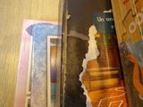 several books are stacked on a table next to each other