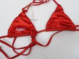 red satin triangle bikini top with lace trims on a white surface