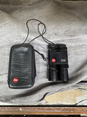 a black case that has a pair of binoculars in it
