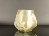 a glass vase that is sitting on a table