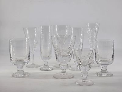 six wine glasses sitting on a table with a white background