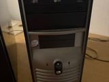 a desktop computer sitting on top of a wooden desk