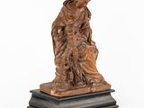 a statue of a woman holding a child on a pedestal