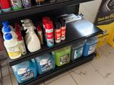 many different types of cleaning products on the shelves
