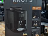 a box of krup ' s coffee maker on a wooden table