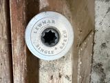 a close up of a door handle with a hole in it