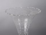 a glass vase that is sitting on a table