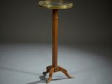 a wooden table with a metal top and a wooden base