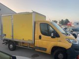 a yellow truck that is parked in a parking lot