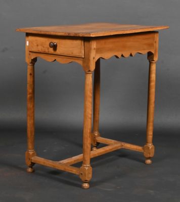 an old wooden table with a drawer on top of it