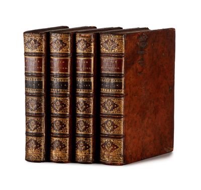 a set of four books sitting on top of each other