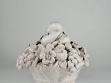 an image of a white vase with a bunch of fruit in it