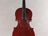 a red violin that is sitting on a stand