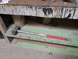 a workbench with tools on top of it in a garage