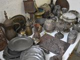 a table with a lot of silver items on it