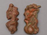 two pieces of clay are sitting next to each other on a table