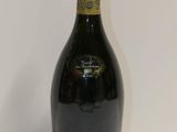 a close up of a bottle of wine on a table