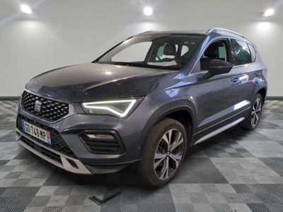 a grey 2020 seat ater parked in a room with checkered floor