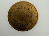 an image of a gold coin on a white surface